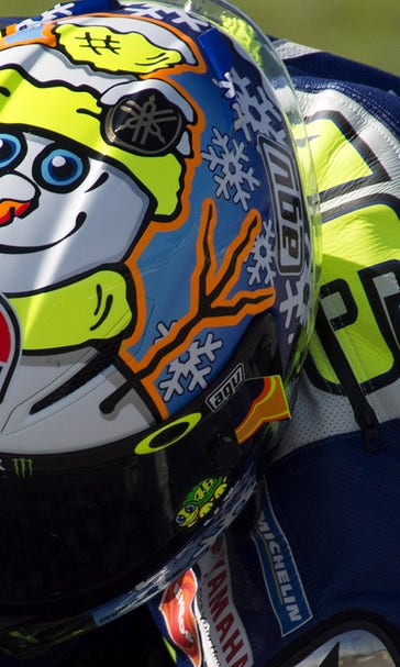 MotoGP: Rossi looking for pace as sports tacky Christmas helmet at test